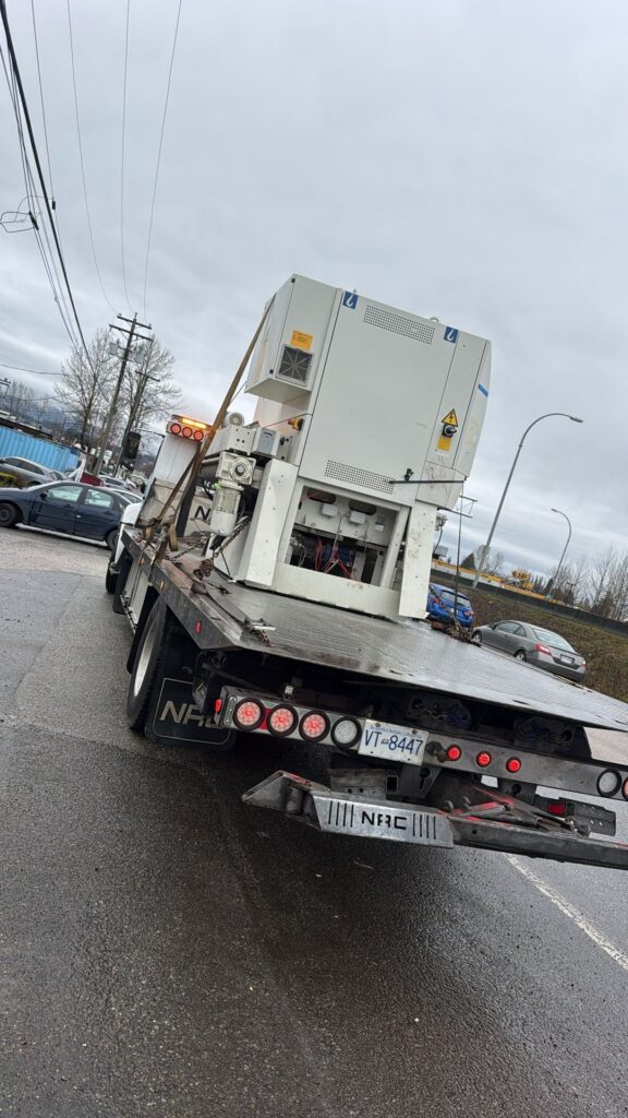 Industrial equipment removal in Langley - factory machine loaded for pickup