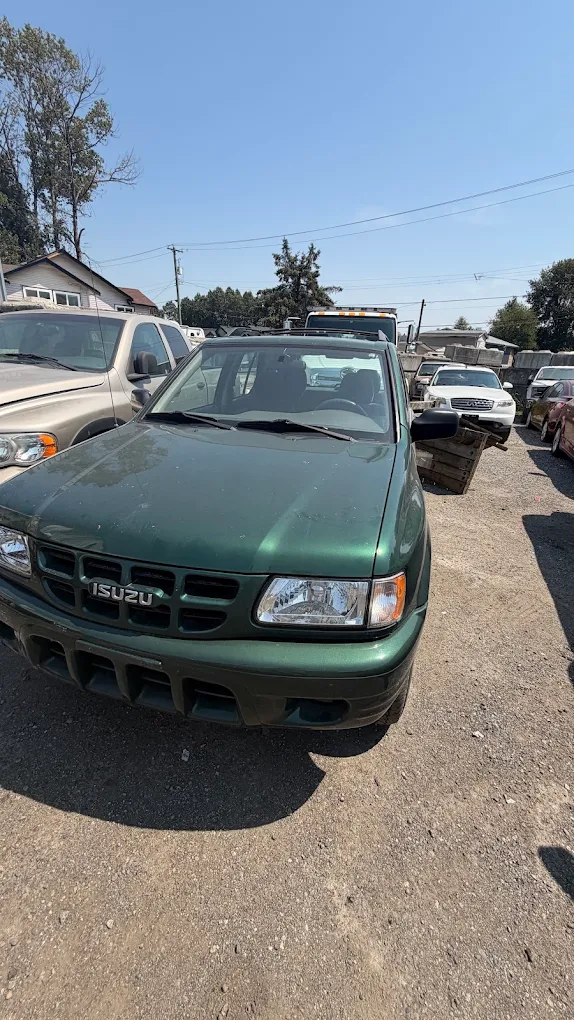 Metal and vehicle collection work by a Langley auto disposal company